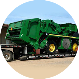 Customer Focus John Deere Cotton Picker on a trailer
